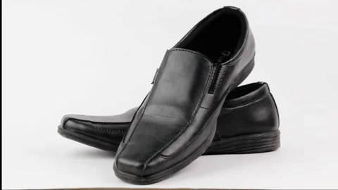 Pair of elegant and simple black leather loafer shoes Stock Footage 319507101