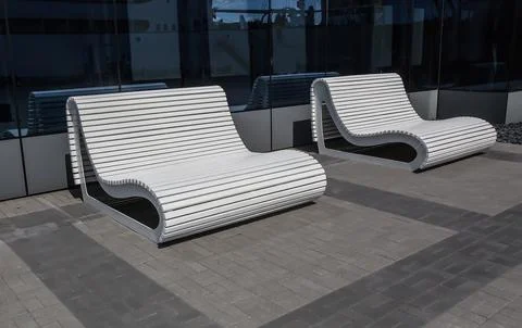 Pair of empty white benches Stock Photos