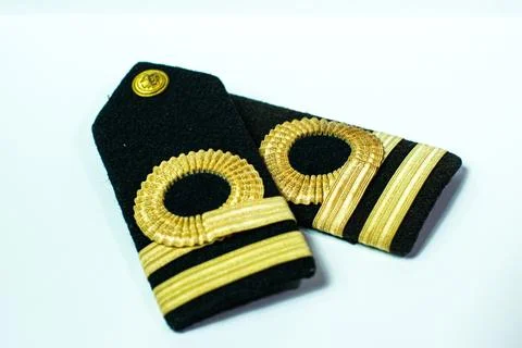 A pair of epaulette gold bar second officers, isolated on white Stock Photos