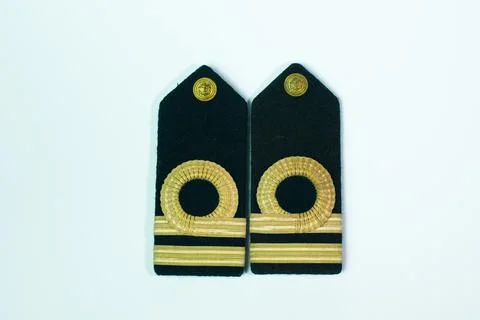 A pair of epaulette gold bar second officers, isolated on white straight si.. Stock Photos
