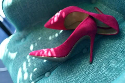 A pair of fashion pink female high heel shoes. heeled shoe close-up on backgr Stock Photos