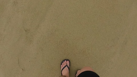 A pair of feet walking on the beach 動画素材 155888095