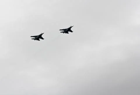 A pair of fighters in the air. Stock Photos