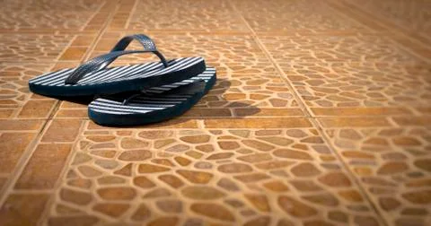 Pair of Flip Flops on a Patio Foto stock