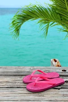 Pair of flip flops on pier Stock Photos