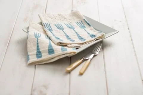 Pair of Fork-Patterned Dinner Napkins on Plate Stock Photos