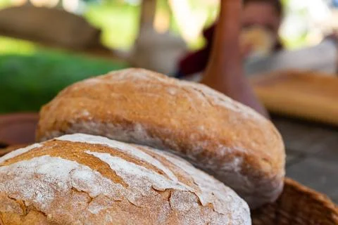 Pair of fresh round bread closeup of a delicious natural baker's street count Foto stock
