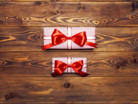 Pair of gift boxes on the wooden board Stock Photos