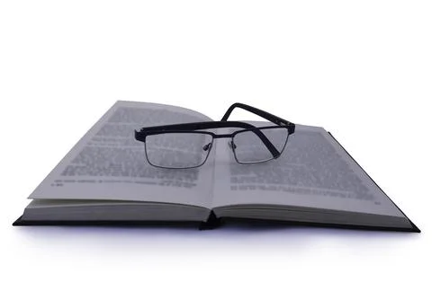 Pair of Glasses on Book Stock Photos