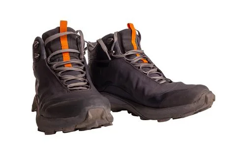 Pair of gray hiking boots,isolate on a white background. Stock Photos