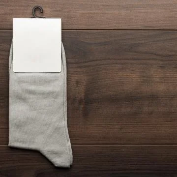 Pair of gray socks with blank packing Stock Photos