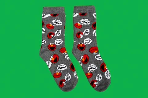 Pair of gray socks on colored background Stock Photos