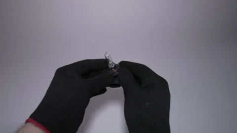 A pair of hands gently holding a keyring that features a key tag Vidéo 303811480