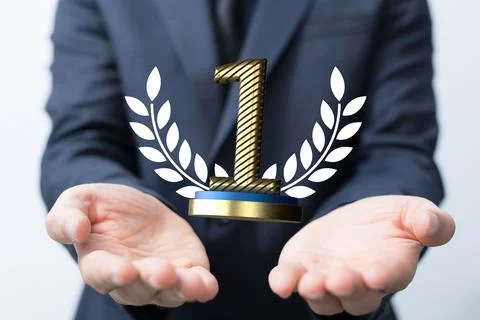 Pair of hands holding a 3D render of a first place trophy 스톡 사진
