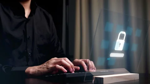A pair of hands on a keyboard, with binary code and programming language overlay Stock Footage 347993320