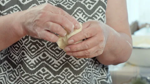 Pair of hands making pastry with dough Stock-Footage 49836776