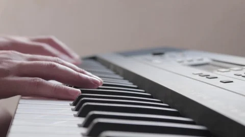 Pair of hands playing a musical keyboard Video stock 106042729