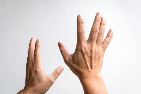 Pair of hands reaching up. Stock Photos