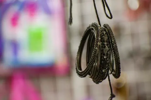 A pair of hanging black bracelets. Stock-Fotos