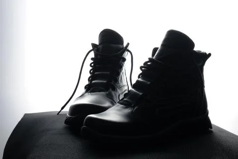 A pair of high black leather handmade ankle boots for man. Art vision. Stock Photos