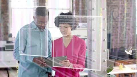 Pair holding tablet, man tapping, casting ghosted binary frames over tablet and Stock Footage 333221562