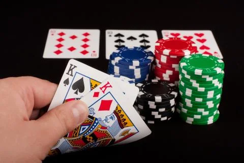 Pair of Kings in Man's Hand Stock Photos