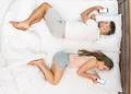 The pair lay on the bed and phone. View from above Photo