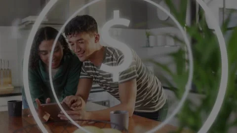 Pair leaning over kitchen island tapping tablet, activating currency overlay, Vídeo Stock 333999948