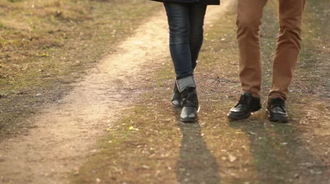 Pair of legs walking in the park Stock Footage 48486458