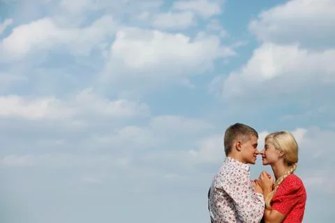 The pair of lovers on a background of sky Stock Photos