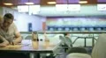 The pair (lovers) sitting at the club cafe (nice interior) HD Footage