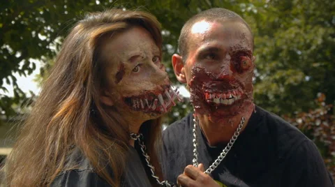 A pair of lovers zombies chained to each other, halloween Stock Footage 68208737