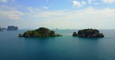 Pair of low karst islands with open sea beyond them Vídeo Stock 71301523