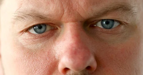 Pair of mail eyes looking in camera closeup Stock Footage 128795329