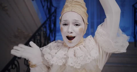 Pair of mimes in beautiful old white theatrical costumes make grimaces faces and Video stock 132434063