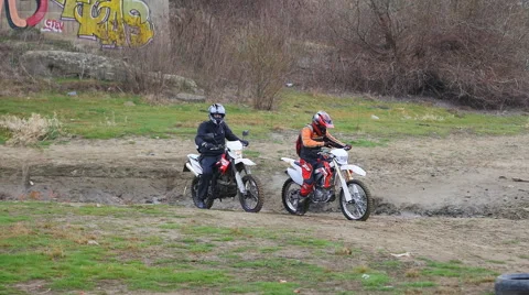 Pair of motorcyclists take the start Stock Footage 68940771
