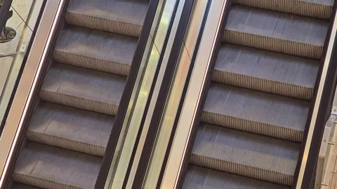 Pair of moving escalators in a shopping mall from above Stock Footage 344708328