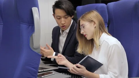 The pair of multiethnical colleagues are preparing for the business presentation Stock Footage 84257594