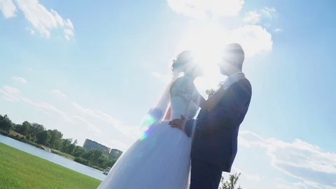 A pair of newlyweds bask in the sun Stock Footage