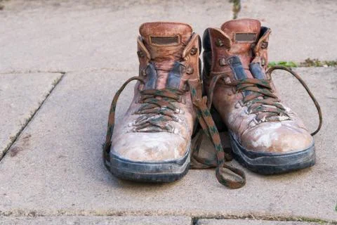 A pair of old brown work boots Stock Photos