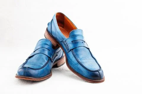 Pair of old leather blue discarded boots with laces Stock Photos