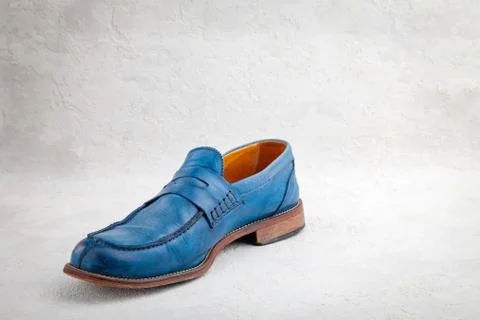 Pair of old leather blue discarded boots with laces Stock Photos
