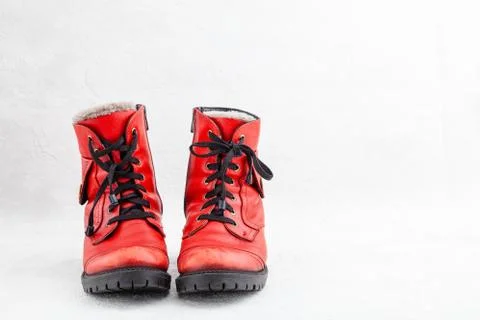 Pair of old leather red discarded boots with laces Stock Photos