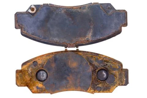 Pair of old rusty worn brake pads Stock Photos