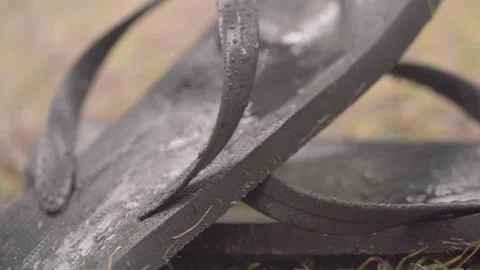 Pair Of Old Wet Flip Flops Left In The Rain. Close Up Shot Stock Footage 291075785