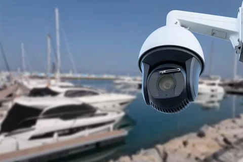 Pair of outdoor security cameras in yachting harbor. Stock Photos