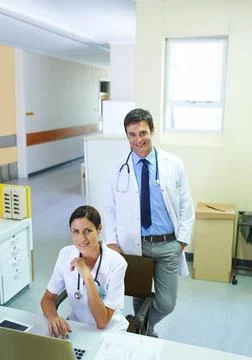 The pair to patch you up. Portrait of a handsome young doctor and his nursing Fotos de archivo