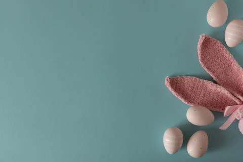 Pair of pink textured Easter bunny ears with pastel pink eggs decorated wit.. Stock Photos
