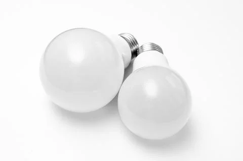 Pair of plastic led bulbs representing the new lighting technology. Stock Photos