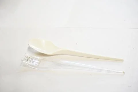 A pair of Plastic Spoon and Fork on the White background 1 Stock Photos